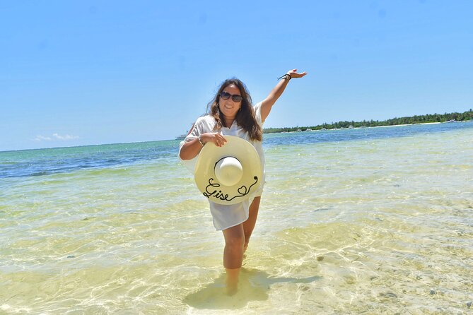 Half-Day Snorkeling Cruise and Natural Pool with Open Bar - Natural pool stop: shallow sandbar water with drinks and a crowd