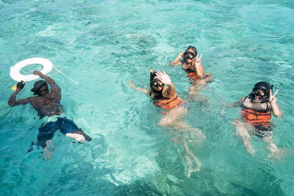 Punta Cana: Catamaran Tour with Reef Snorkeling and Open Bar - Onboard vibe: open bar, snacks, and a crew with momentum